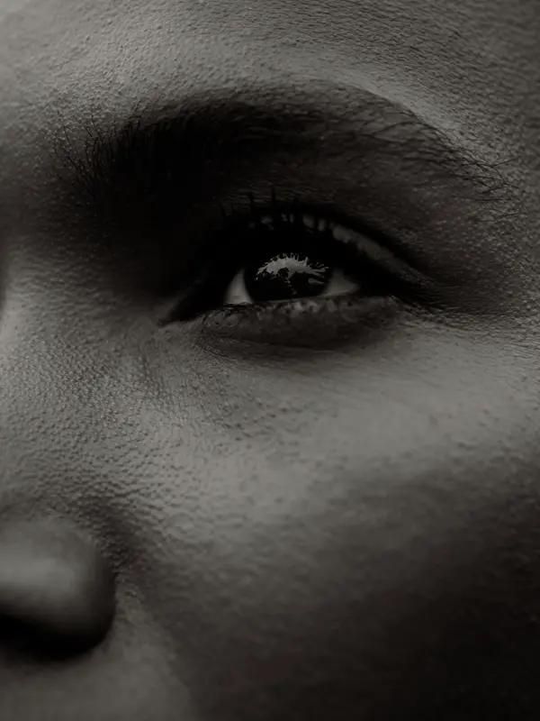 Black-and-white close-up photograph of an eye from the lookbook series