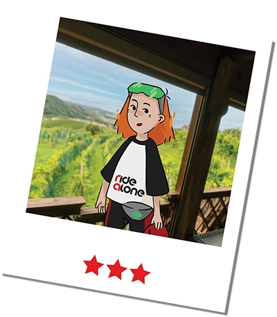 Frame of the ridealone mascotto taking a selfie in front of a churc in asolo