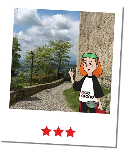 Frame of the ridealone mascotte riding a bike in valle delle mure in montegrappa